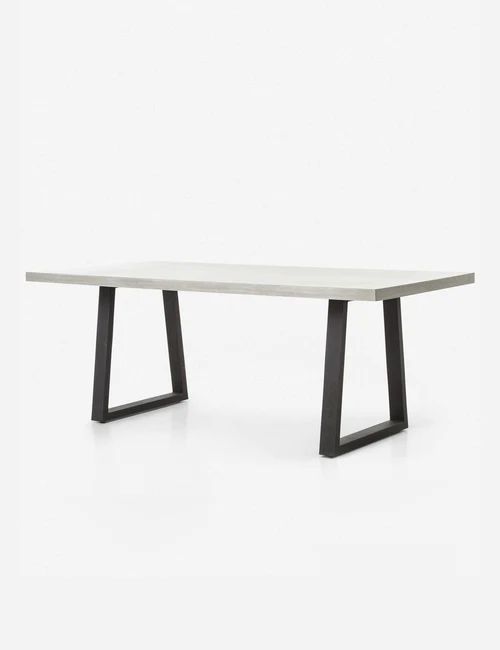 Industrial rectangular table with concrete-look top and black trapezium metal legs – modern dining or office furniture