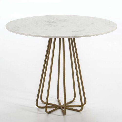 Round white marble table with gold geometric metal base