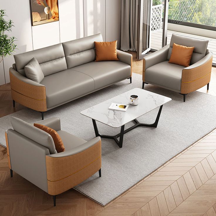 Luxury grey leatherette and rattan sofa set featuring a three-seater, two armchairs, and a marble-top coffee table in a modern living room setting.