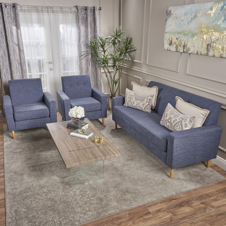 Modern blue fabric sofa set with wooden legs, featuring a 3-seater sofa and 2 armchairs in a contemporary living room setting.