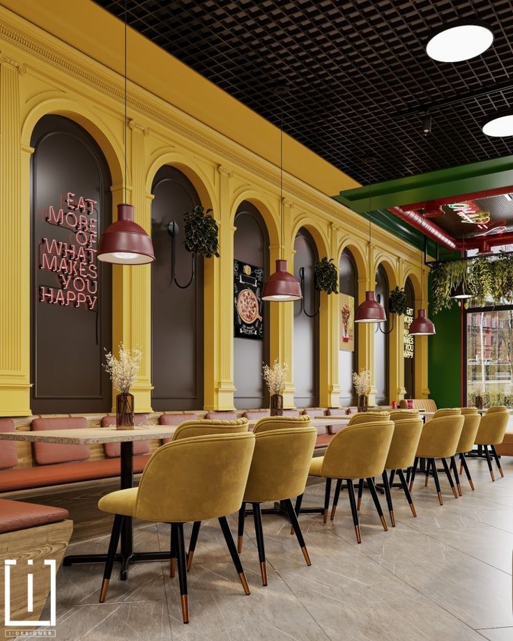 Vibrant café with yellow arches, mustard velvet chairs, long table setup, red pendant lighting, and a neon quote sign on the wall.