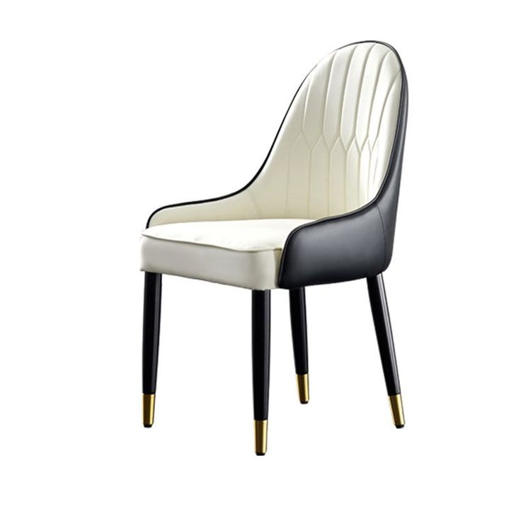 Modern black and white faux leather chair with gold-tipped black legs and a curved high backrest.