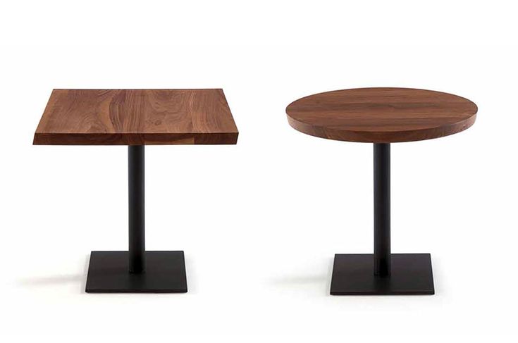 Square and round wooden restaurant tables with black metal bases, featuring a modern and elegant design.