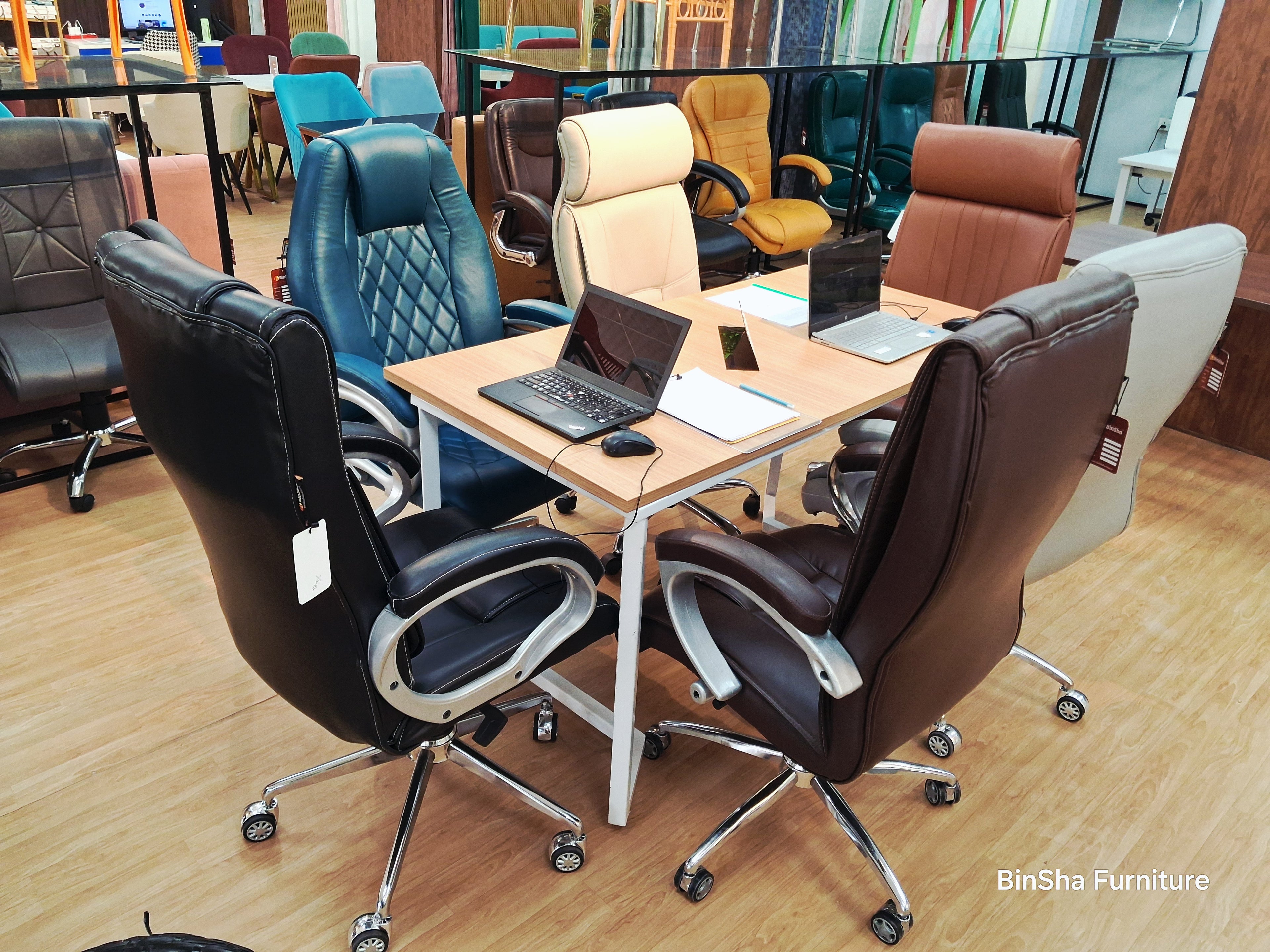 Premium conference table with leather executive chairs for boardroom meetings