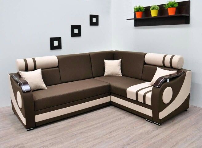 Modern L-shaped brown and beige sectional sofa with decorative armrests and storage, set in a stylish living room interior.