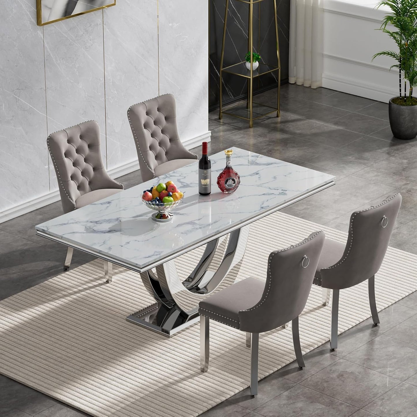 white marble dining table with tufted grey velvet chairs and chrome legs, perfect for modern and elegant dining spaces