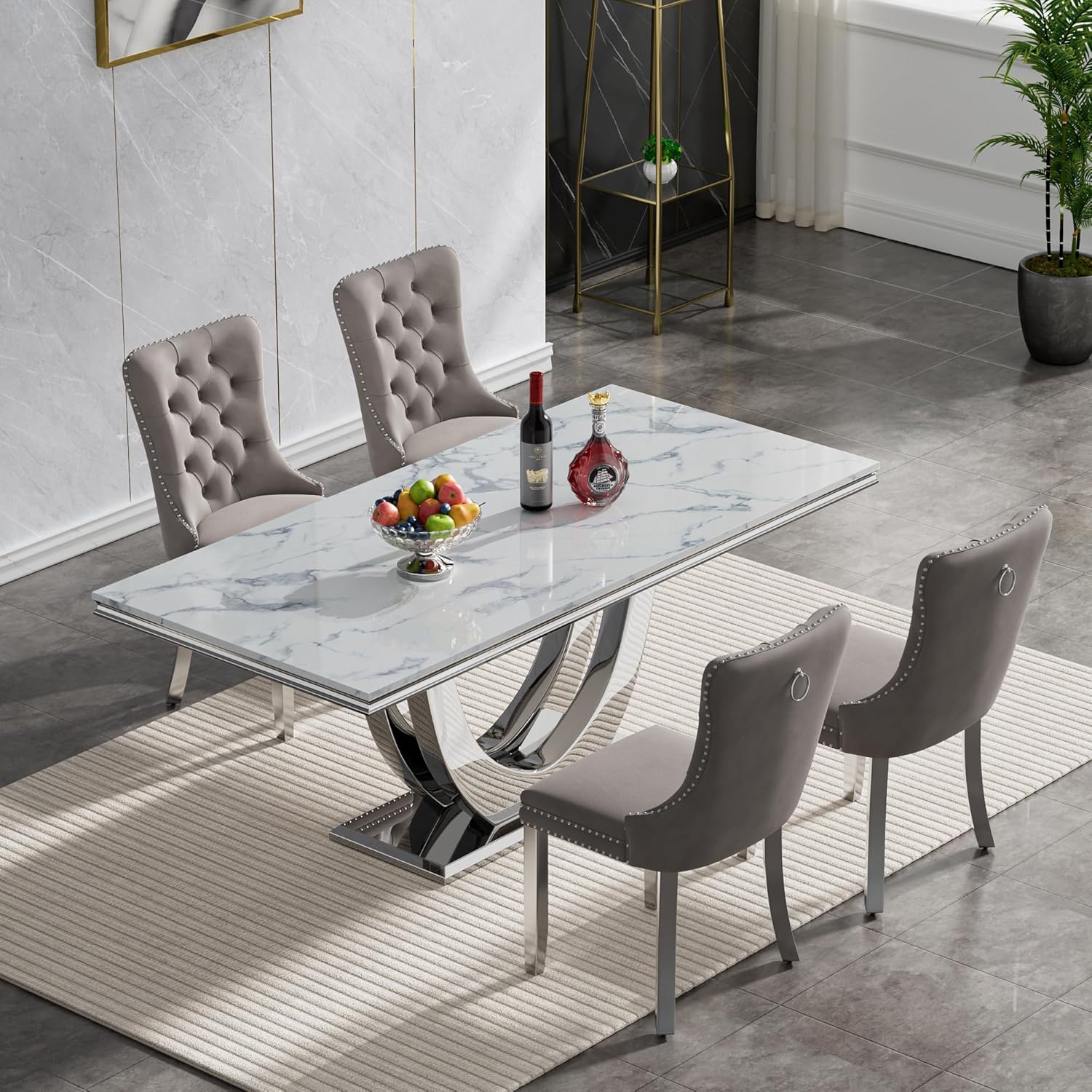 white marble dining table with tufted grey velvet chairs and chrome legs, perfect for modern and elegant dining spaces