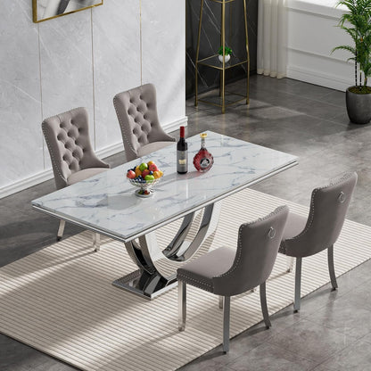 white marble dining table with tufted grey velvet chairs and chrome legs, perfect for modern and elegant dining spaces