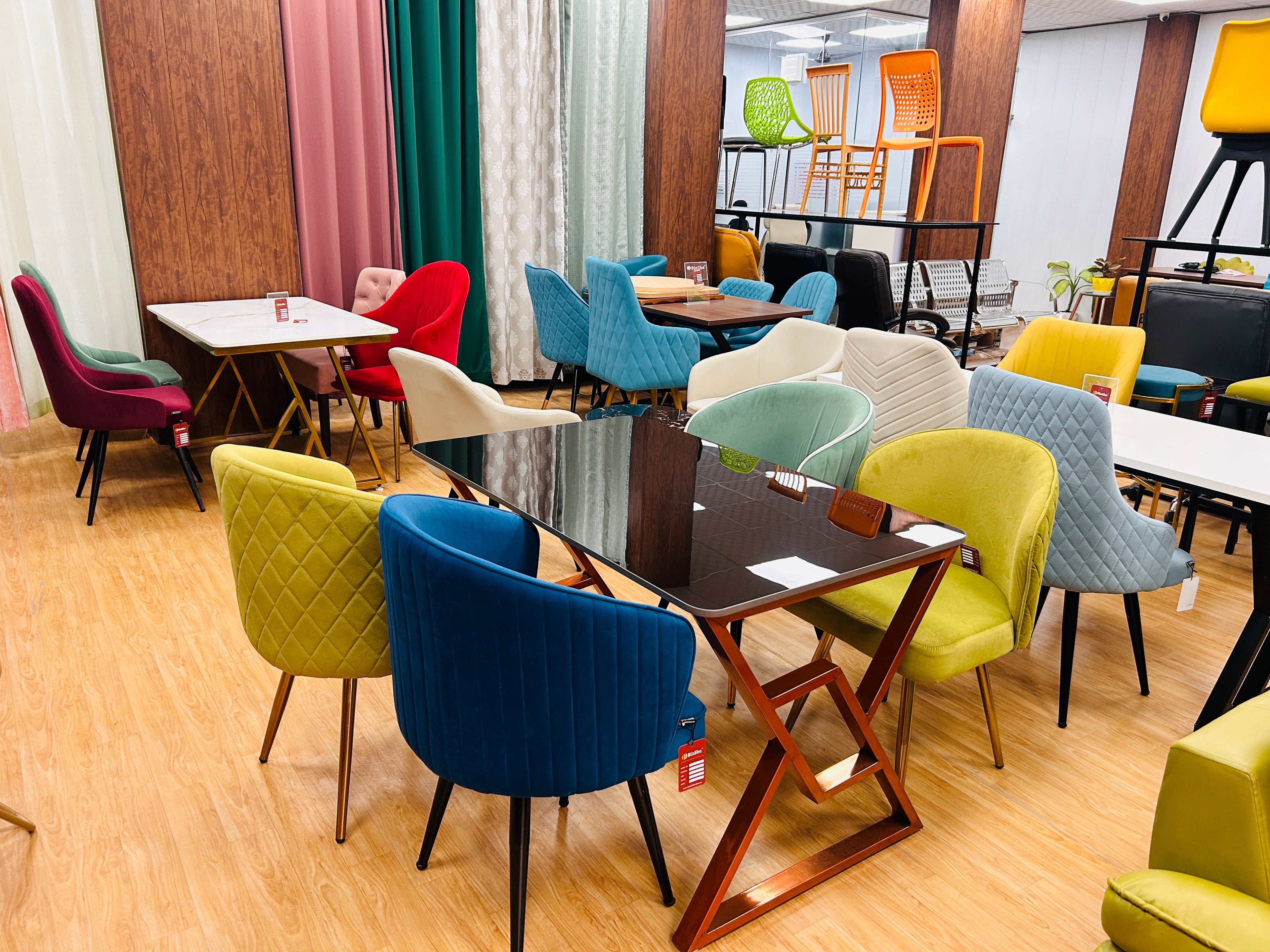 Colorful chairs around tables in a modern interior setting